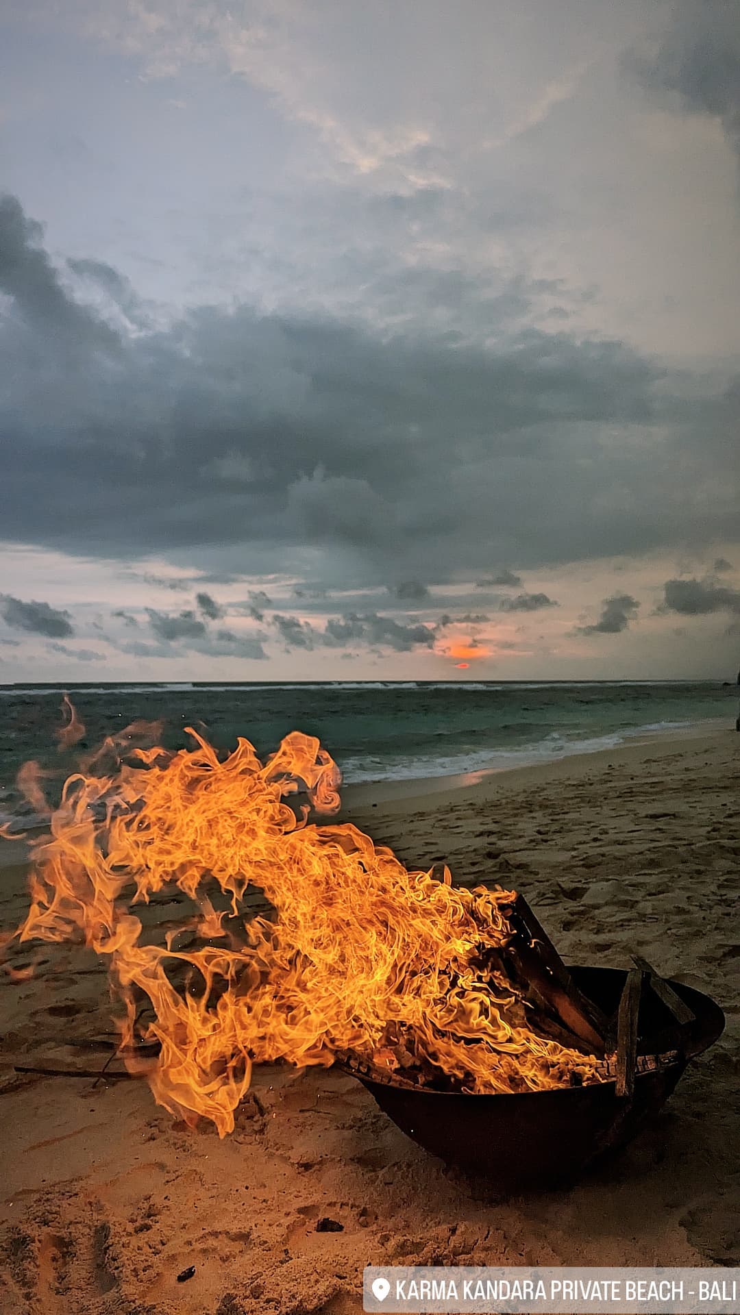 Beach bonfire at sunset
